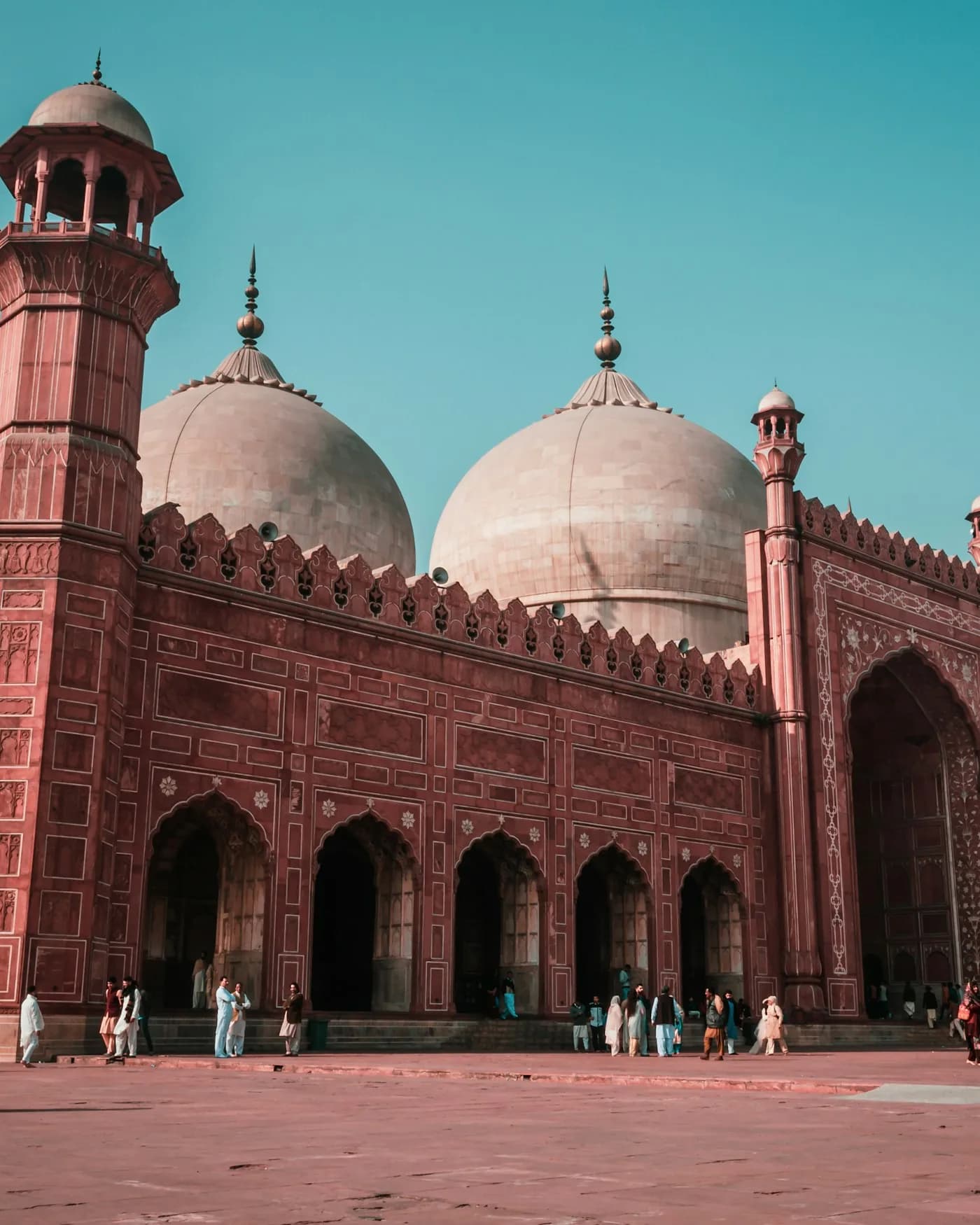 Mughal-era brickwork and domes of a historic Lahore monument