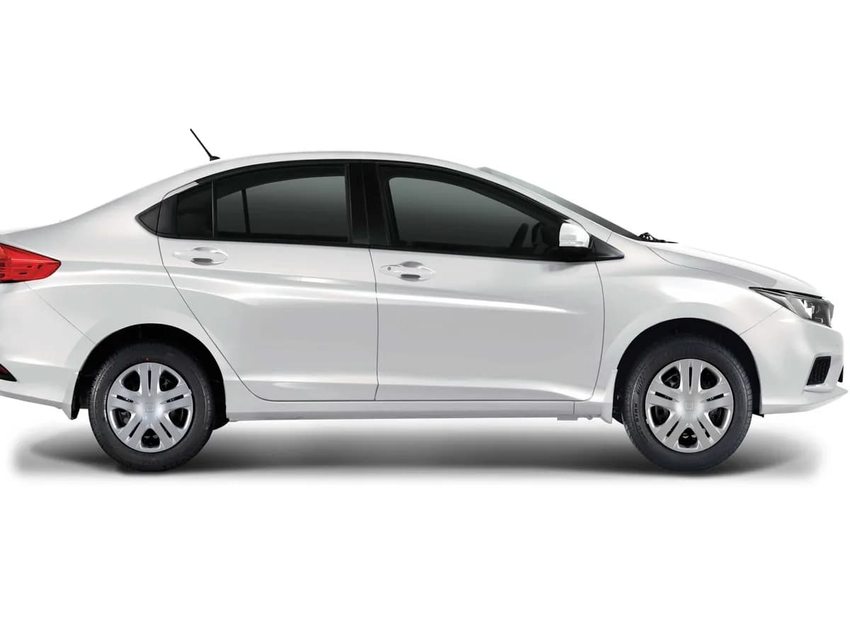 A white Honda City, rentable from a local host in Karachi